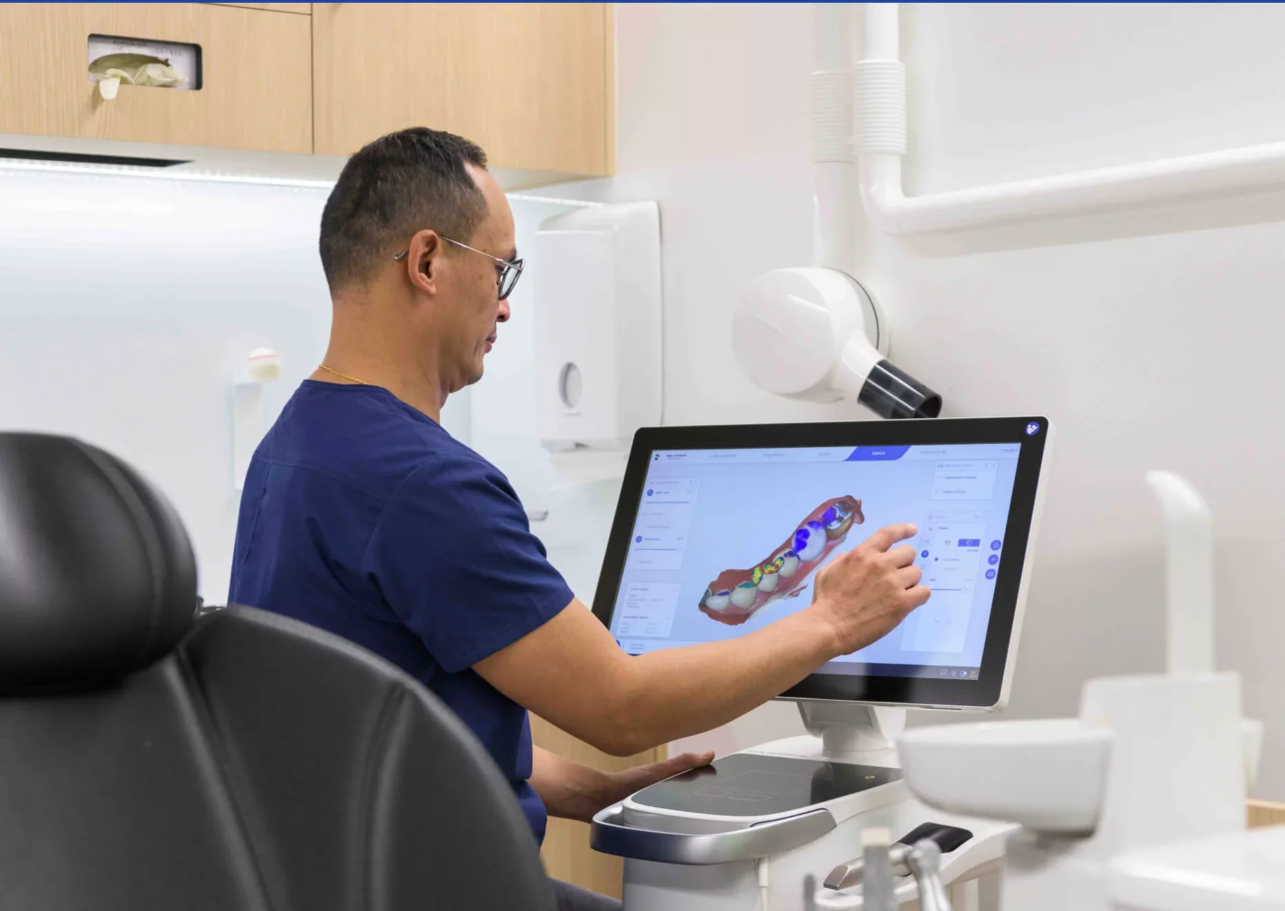 Gentle Dental dentist examines dental imagery